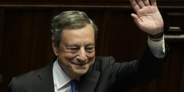 Italian Premier Mario Draghi waves to lawmakers at the end of his address at the Parliament in Rome Thursday, July 21, 2022. 