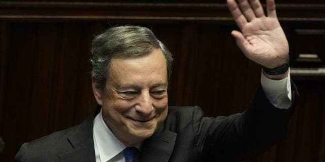 Italian Premier Mario Draghi waves to lawmakers at the end of his address at the Parliament in Rome Thursday, July 21, 2022. 