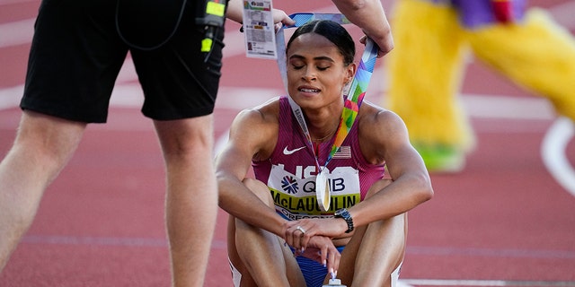 Sydney McLaughlin, of the United States, receives her Gold medal after the final of the women's 400-meter hurdles at the World Athletics Championships on Friday, July 22, 2022, in Eugene, Ore. 