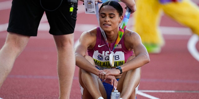 Sydney McLaughlin, of the United States, receives her Gold medal after the final of the women's 400-meter hurdles at the World Athletics Championships on Friday, July 22, 2022, in Eugene, Ore.