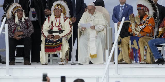 Pope Francis delivers his speech as he meets the indigenous communities, including First Nations, Metis and Inuit, at Our Lady of Seven Sorrows Catholic Church in Maskwacis, near Edmonton, Canada, Monday, July 25, 2022. Pope Francis begins a "penitential" visit to Canada to beg forgiveness from survivors of the country's residential schools, where Catholic missionaries contributed to the "cultural genocide" of generations of Indigenous children by trying to stamp out their languages, cultures and traditions. Francis set to visit the cemetery at the former residential school in Maskwacis. (AP Photo/Gregorio Borgia)