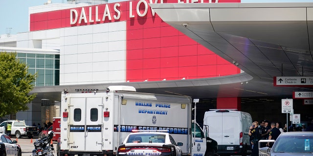 A crime scene response vehicle arrives at Dallas Love Field in Dallas, Monday, July 25, 2022, after a woman allegedly opened fire by a ticketing counter inside. 