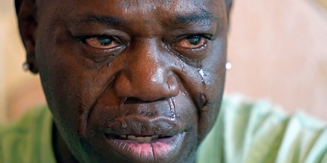 Aaron Larry Bowman cries during an interview at his attorney's office in Monroe, Louisiana, as he discusses his injuries resulting from a Louisiana state trooper pummeling him with a flashlight during a traffic stop. Louisiana has dropped its case against Bowman, whose severe beating before his arrest in 2019 led to criminal charges and lawsuits against a state trooper.