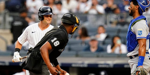 The New York Yankees' Andrew Benintendi, left, talks to Kansas City Royals catcher MJ Melendez during the first inning of their MLB game in New York on Thursday, July 28, 2022. 