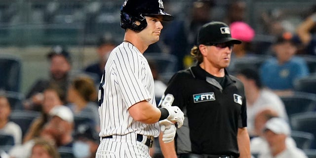 The New York Yankees' Andrew Benintendi reacts after hitting a fly out during the ninth inning of a game against the Kansas City Royals July 28, 2022, in New York.