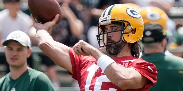 Green Bay Packers' Aaron Rodgers runs a drill at the NFL football team's practice field Tuesday, June 7, 2022, in Green Bay, Wis.