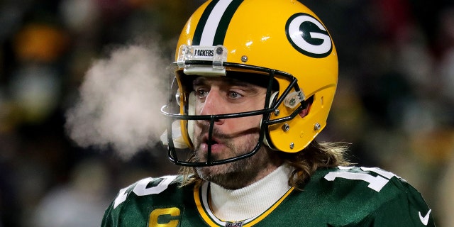 Jan 22, 2022; Green Bay, Wisconsin, USA; Green Bay Packers quarterback Aaron Rodgers (12) warms up before the Green Bay Packers divisional playoff game against the San Francisco 49ers at Lambeau Field.