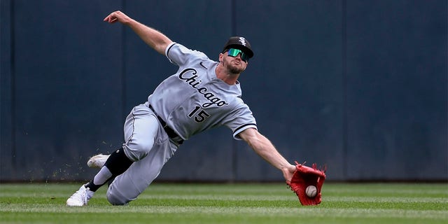 Chicago White Sox center fielder Adam Engel catches a fly ball hit by Minnesota Twins' Carlos Correa during the first inning of a baseball game, Sunday, July 17, 2022, in Minneapolis. The Twins won 6-3. 