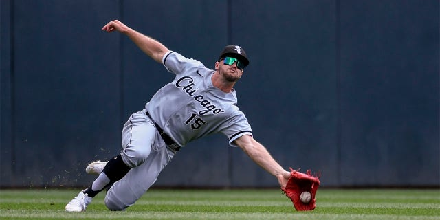 Chicago White Sox center fielder Adam Engel catches a fly ball hit by Minnesota Twins' Carlos Correa during the first inning of a baseball game, Sunday, July 17, 2022, in Minneapolis. The Twins won 6-3.