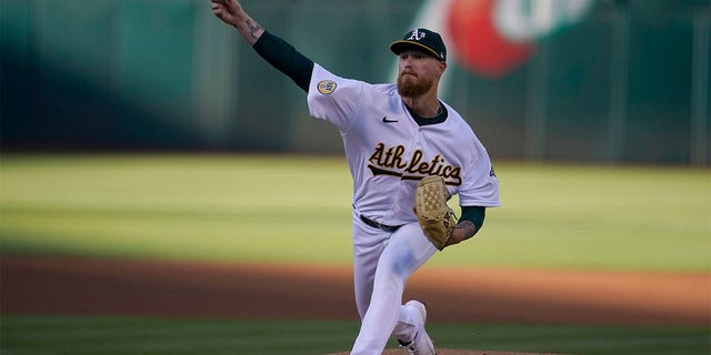 Oakland Athletics' Adam Oller pitches against the Houston Astros during the first inning of a baseball game in Oakland, Calif., Monday, July 25, 2022. 