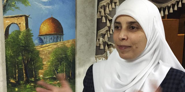 In this photo taken March 21, 2017, Ahlam al-Tamimi is photographed during an interview in her home in the Jordanian capital of Amman. (AP Photo/Omar Akour)