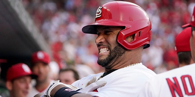 Cardinals' Albert Pujols celebrates after hitting a solo home run against the Los Angeles Dodgers, July 12, 2022, in St. Louis.