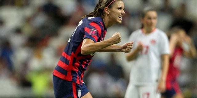 United States' Alex Morgan celebrates scoring her side's opening goal from the penalty spot against Canada during the CONCACAF Women's Championship final soccer match in Monterrey, Mexico, Monday, July 18, 2022.
