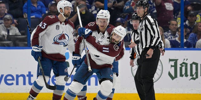 Colorado Avalanche center Andrew Cogliano (11) reacts after scoring during the third period of Game 4 of the NHL hockey Stanley Cup Finals against the Tampa Bay Lightning on Wednesday, June 22, 2022, in Tampa, Fla. 