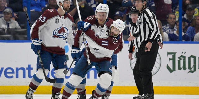 Colorado Avalanche center Andrew Cogliano (11) reacts after scoring during the third period of Game 4 of the NHL hockey Stanley Cup Finals against the Tampa Bay Lightning on Wednesday, June 22, 2022, in Tampa, Fla. 