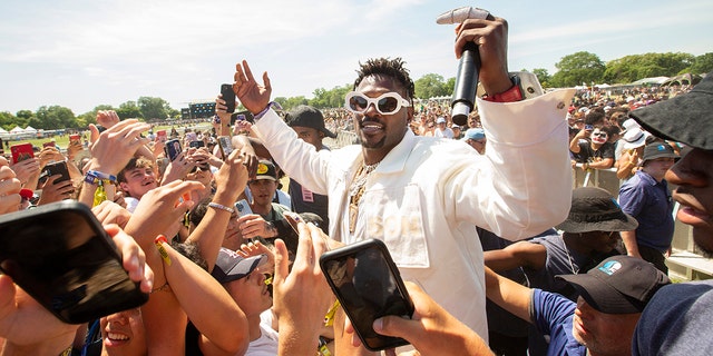 Antonio Brown performs with GloUpJake during the Summer Smash Festival at Douglass Park in Chicago, Illinois, on June 19, 2022.