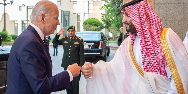 Saudi Crown Prince Mohammed bin Salman fist bumps US President Joe Biden upon his arrival at Al Salman Palace, in Jeddah, Saudi Arabia.