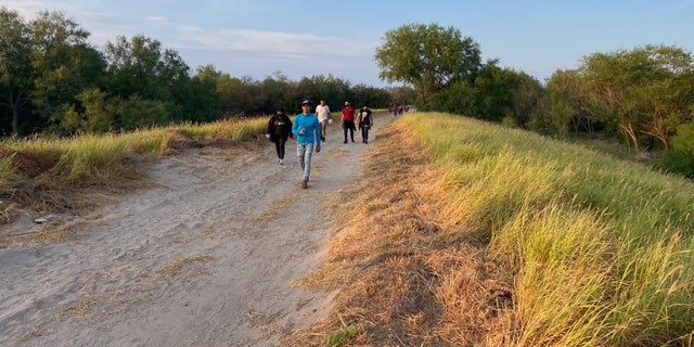 People who crossed the U.S.-Mexico border illegally search for Border Patrol in La Joya, Texas. Families and unaccompanied children in this area often turn themselves in.