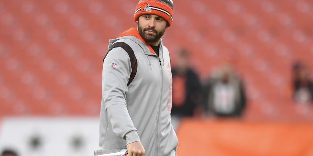 Browns quarterback Baker Mayfield walks on the field before the Cincinnati Bengals game on, Jan. 9, 2022, in Cleveland.