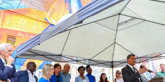 Xavier Becerra, Secretary of the Department of Health and Human Services, speaks during a press conference on the kickoff of 988, a new national mental health hotline, Friday, July 15, 2022, in Philadelphia. The press conference took place in front of the Contemplation, Clarity and Resilience mural by artist Eric Okdeh, which is a mural that represents, among many other things, the process of overcoming hardships. The United States’ first nationwide three-digit mental health crisis hotline (988) goes live on Saturday.