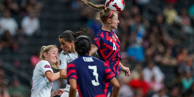 United States' Becky Sauerbrunn (4) heads the ball during the CONCACAF Women's Championship final soccer match against Canada in Monterrey, Mexico, Monday, July 18, 2022. 
