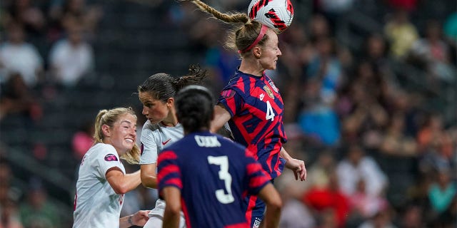 United States' Becky Sauerbrunn (4) heads the ball during the CONCACAF Women's Championship final soccer match against Canada in Monterrey, Mexico, Monday, July 18, 2022.