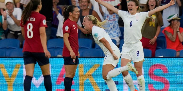 England's Beth Mead celebrates with Ellen White, right, after scoring her side's fifth goal during the Women Euro 2022 group A soccer match between England and Norway at Brighton & Hove Community Stadium in Brighton, England, Monday, July 11, 2022.