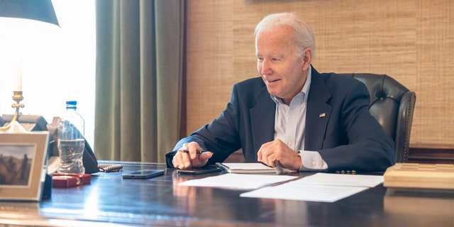 President Biden released a photo of himself in the White House after testing positive for COVID-19 on Thursday, July 21, 2022.