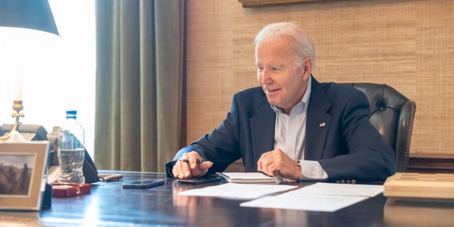 President Biden released a photo of himself in the White House after testing positive for COVID-19 on Thursday, July 21, 2022.