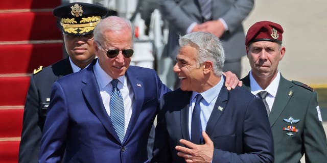 U.S. President Joe Biden is welcomed by Israeli caretaker Prime Minister Yair Lapid upon his arrival at Ben Gurion Airport on Wednesday.