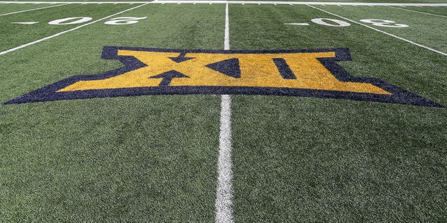 The Big 12 logo on the field before the college football game between the Texas Tech Red Raiders and the West Virginia Mountaineers on October 2, 2021, at Mountaineers Field at Milan Pusker Stadium in Morgantown, WV. 