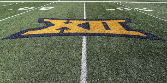 The Big 12 logo on the field prior to the college football game between the Texas Tech Red Raiders and the West Virginia Mountaineers on October 2, 2021, at Mountaineer Field at Milan Puskar Stadium in Morgantown, WV.