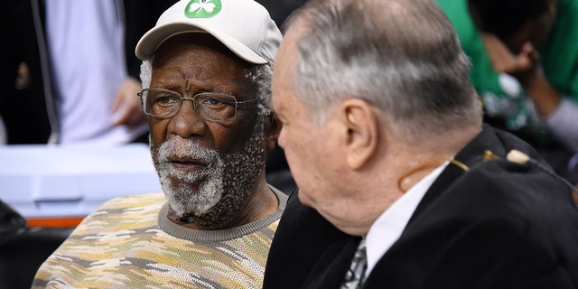 Former Boston Celtics players Bill Russell, left, and Tom Heinsohn watch the game between the Celtics and the Atlanta Hawks in Game 6 of the Eastern Conference quarterfinals, April 28, 2016, at TD Garden in Boston, Massachusetts.