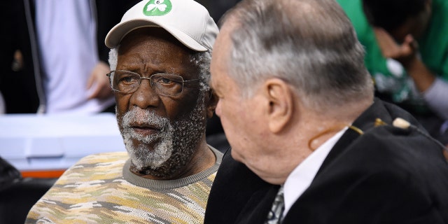 Former Boston Celtics players Bill Russell, left, and Tom Heinsohn watch the game between the Celtics and the Atlanta Hawks in Game 6 of the Eastern Conference quarterfinals, April 28, 2016, at TD Garden in Boston, Massachusetts.