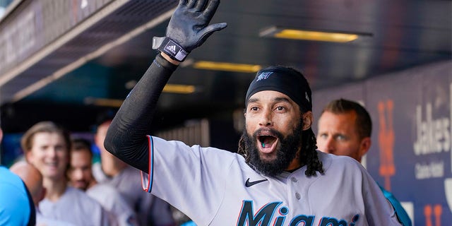 Miami Marlins' Billy Hamilton celebrates after scoring off a throwing error by New York Mets catcher Tomas Nido during the tenth inning of a baseball game, Sunday, July 10, 2022, in New York. 
