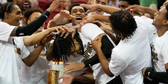 Portland Trail Blazers celebrate after defeating the New York Knicks in an NBA summer league championship basketball game Sunday, July 17, 2022, in Las Vegas.