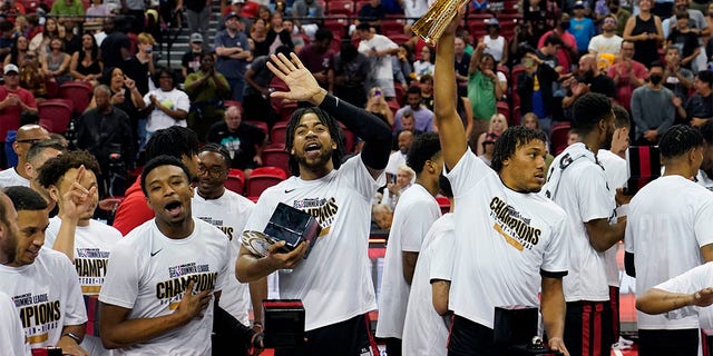 Portland Trail Blazers' Trendon Watford, center, celebrates with teammates after defeating the New York Knicks in an NBA summer league championship basketball game Sunday, July 17, 2022, in Las Vegas. 