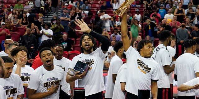 Portland Trail Blazers' Trendon Watford, center, celebrates with teammates after defeating the New York Knicks in an NBA summer league championship basketball game Sunday, July 17, 2022, in Las Vegas.