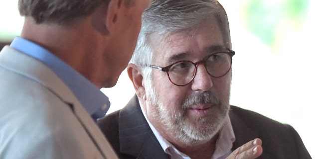 Longtime ESPN anchor Bob Ley, right, speaks with ESPN coordinating director Chip Dean at the company's 40th anniversary celebration Friday.