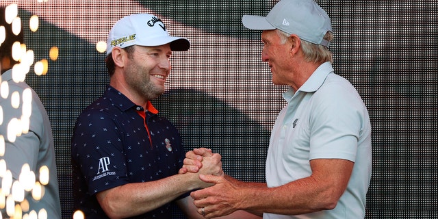 LIV Golf CEO Greg Norman on the right congratulates Branden Grace, the winner of the Portland Invitational LIV Golf Tournament on July 2, 2022 in North Plains, Oregon.