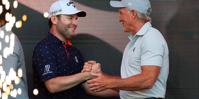 Greg Norman, CEO of LIV Golf on the right, congratulates Branden Grace, the winner of the Portland Invitational LIV Golf Tournament on Saturday, July 2, 2022 in North Plains, Oregon. 