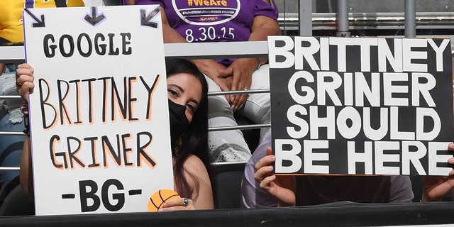 Fans hold signs supporting Brittney Griner, #42 of the Phoenix Mercury, during the game against the Los Angeles Sparks on July 4, 2022 at Crypto.com Arena in Los Angeles, California.