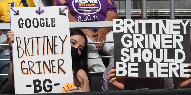 Fans hold signs supporting Brittney Griner, #42 of the Phoenix Mercury, during the game against the Los Angeles Sparks on July 4, 2022 at Crypto.com Arena in Los Angeles, California.