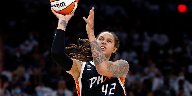 Phoenix Mercury center Brittney Griner (42) shoots during the first half of Game 1 of the WNBA basketball Finals against the Chicago Sky, on Oct. 10, 2021, in Phoenix.