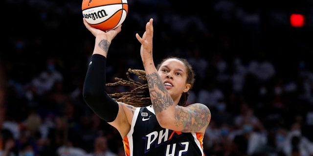 Phoenix Mercury center Brittney Griner (42) shoots during the first half of Game 1 of the WNBA basketball Finals against the Chicago Sky, on Oct. 10, 2021, in Phoenix.