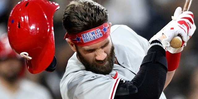 Bryce Harper #3 of the Philadelphia Phillies is struck off the pitch during the fourth inning of a baseball game against the San Diego Padres on June 25, 2022 at Petco Park in San Diego, California.