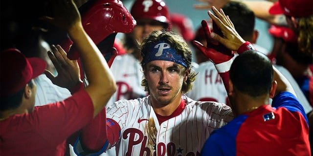 Philadelphia Phillies' Bryson Stott celebrates after hitting a three-un home run off Atlanta Braves' A.J. Minter during the eighth inning of a baseball game, Monday, July 25, 2022, in Philadelphia. 