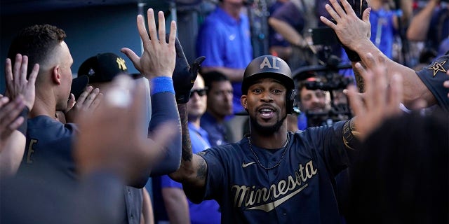 American League's Byron Buxton, of the Minnesota Twins, celebrates in the dugout after hitting a solo home run during the fourth inning of the MLB All-Star baseball game against the National League, Tuesday, July 19, 2022, in Los Angeles.