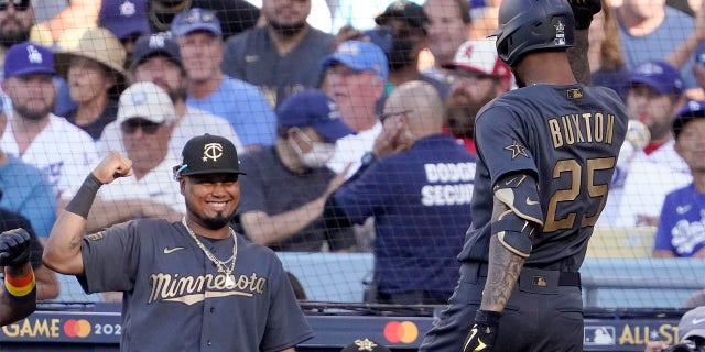 American League's Byron Buxton (25), reacts with Luis Arraez, both of the Minnesota Twins, after hitting a solo home run off National League pitcher Tony Gonsolin, of the Los Angeles Dodgers, during the fourth inning of the MLB All-Star baseball game, Tuesday, July 19, 2022, in Los Angeles.