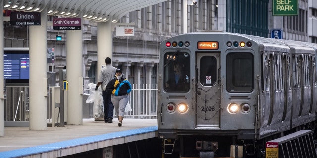 A train arrives at a nearly empty Chicago Transit Authority (CTA) station in Chicago, Illinois, U.S., on Wednesday, June 3, 2020. 